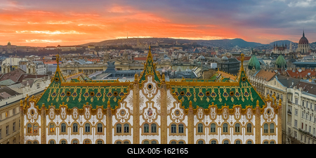 Amazing roof in Budapest, Hungary. State Treasury building with Hungarian Parliament in winter time.  All tiles on the roof made from the world famous Zsolnay pyro granite.-stock-foto