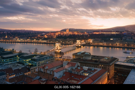 Sunset cityscape from Budapest with Danube river, Szechenyi chain bridge, Buda caslle, Varkert bazaar  and sandor palace.-stock-foto