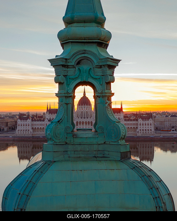Unique photo about the Hungarian Parliament building through a church belltower. Amazing morning mood.-stock-foto