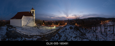 Winter panorama in Pécs, the county seat of Baranya. On the left side is Havihegy church, on the right side is the tv tower with floodlight.-stock-foto