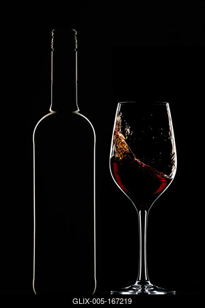 Red wine bottle and filled glass-stock-foto