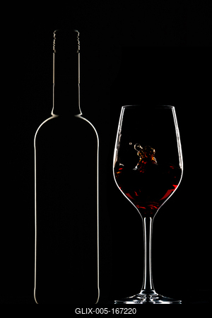 Red wine bottle and filled glass-stock-foto