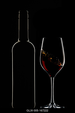 Red wine bottle and filled glass-stock-foto