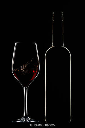 Red wine bottle and filled glass-stock-foto