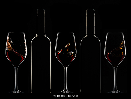 Red wine bottles and filled glasses-stock-foto