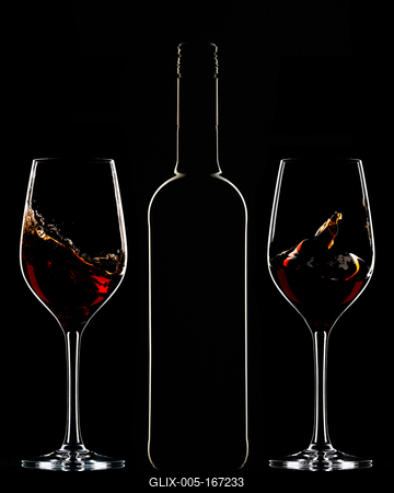 Red wine bottle and filled glass-stock-foto