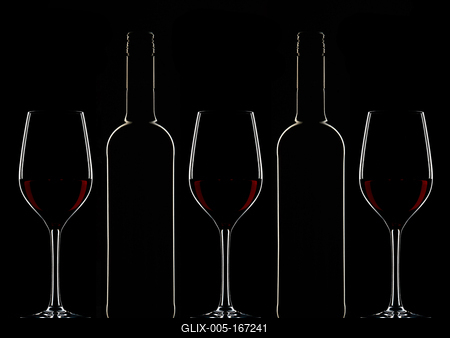 Red wine bottles and filled glasses-stock-foto