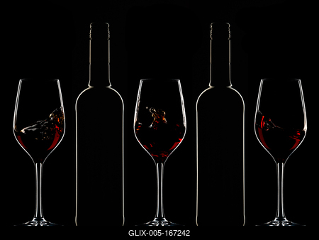 Red wine bottles and filled glasses-stock-foto