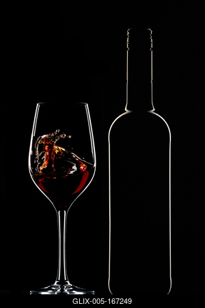 Red wine bottle and filled glass-stock-foto