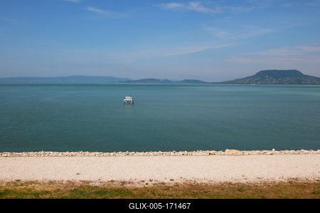 Landscape by lake Balaton with white bench in the water.-stock-foto