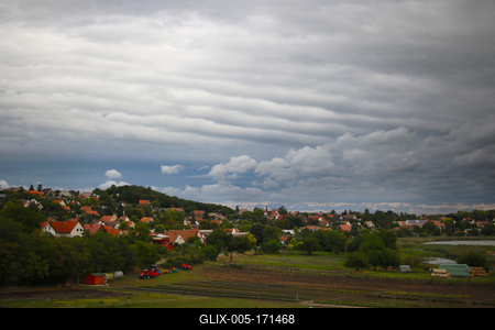 Landscape with houses and clouds in summer.-stock-foto