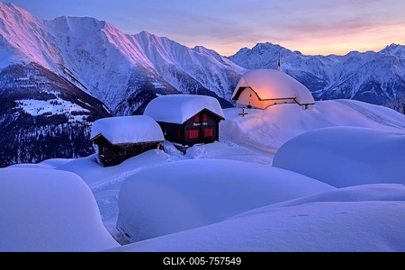 Maria in the snow in the village centre, in the back Fletschhorn 3985m at dusk, Bettmeralp, Aletsch area, Upper Valais, Valais, Switzerland-stock-foto