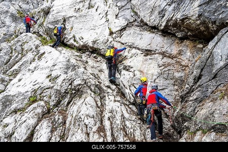 Mountain rescuers from Bergwacht Bayern climbing a steep rock face on Hoher Göll, Berchtesgaden, Berchtesgadener Land, Upper Bavaria, Bavaria, Germany-stock-foto