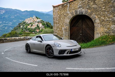 Re-enactment of classic photo of Porsche 911 at historic section of Monte Carlo Rally 1965 with modern supercar sports car Porsche GT3, in the background La Roquette-sur-Var, Département Alpes-Maritimes, Region Provence-Alpes-Côte d'Azur, France-stock-foto