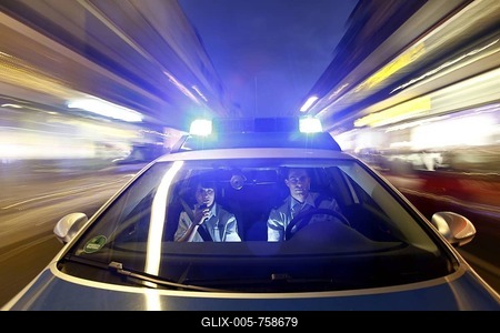 Police patrol car driving with flashing lights and sirens, Germany, Europe-stock-foto