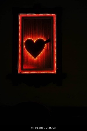 Illuminated window, heart, brothel, night scene-stock-foto