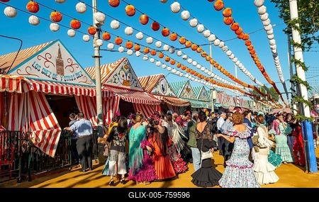 Celebrating Spaniards in traditional dress in front of marquees, casetas, decorated street, Feria de Abril, Sevilla, Andalusia, Spain-stock-foto