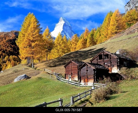 Wooden huts in front of larch trees with autumnal foliage and Mt Matterhorn, near Zermatt, Canton of Valais, Switzerland-stock-foto