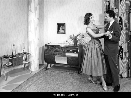 Couple dancing in the living room, historic picture from about 1955-stock-foto