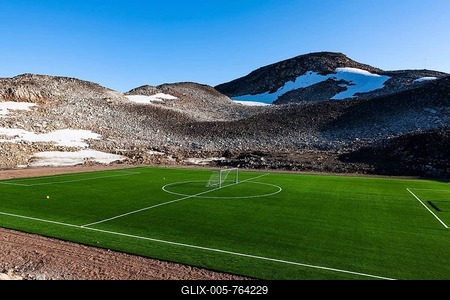 Football pitch with artificial turf, Ittoqqortoormiit, Scoresbysund, East Greenland, Greenland-stock-foto