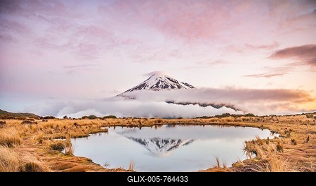 Reflection in Pouakai Tarn, stratovolcano Mount Taranaki or Mount Egmont at sunset, Egmont National Park, Taranaki, North Island, New Zealand-stock-foto