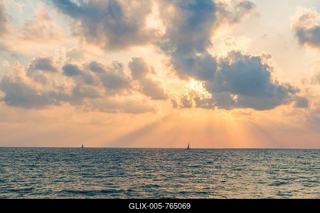 Sunset over the sea, sailboat on the horizon, Tel Aviv, Israel-stock-foto