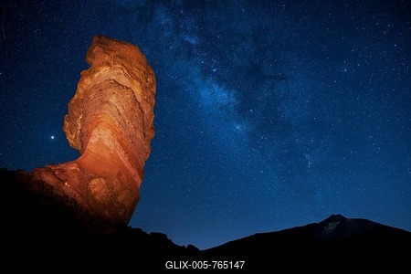 Illuminated Roque Chinchado in front of Pico del Teide with starry sky, Milky Way, night scene at new moon, Los Roques de Garcia, Las Cańadas, National Park Teide, Tenerife, Canary Islands, Spain-stock-foto