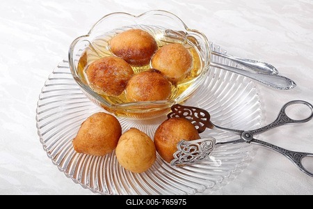 Swabian dessert on glass plate with pastry tongs, Fried, Versoffene Jungfern with wine, Swabia, Germany-stock-foto