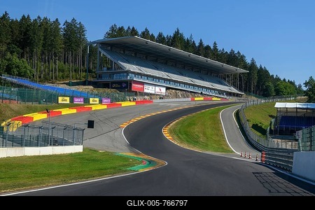 View from racing car perspective of racing driver while driving into dangerous curve Eau Rouge on 40 metres high driveway Raidillon of Circuit de Spa Francorchamps, in the background new built grandstand for spectators of car races, FIA Formula 1 circuit, Circuit de Spa Francorchamps, Ardennes roller coaster, Ardennes, Malmedy, Belgium-stock-foto