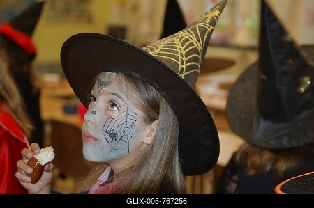 Portrait of a little girl with a witch costume-stock-foto