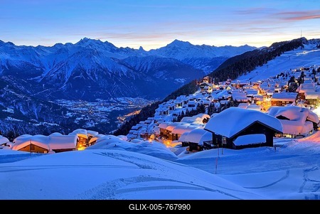 View of the snow-covered village overlooking the Rhone valley towards Dom 4545m, Matterhorn 4478m and Weisshorn 4505m, evening twilight, Bettmeralp, Aletsch area, Upper Valais, Valais, Switzerland-stock-foto