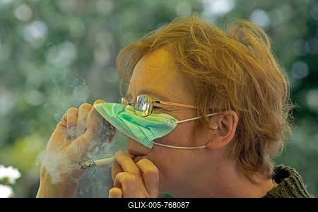 Older woman smoking with a face mask, portrait, cigarette break, corona crisis, Germany-stock-foto