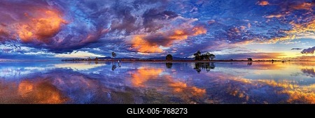 Panorama with glorious sunset at Carters Beach, cloudy sky, Water Reflection, Westport, West Coast, Southland, New Zealand-stock-foto