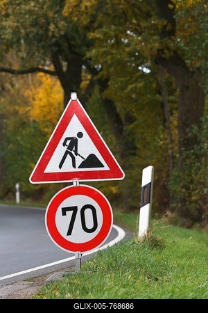 Road sign on curve, speed limit and construction work, Schleswig-Holstein, Germany-stock-foto