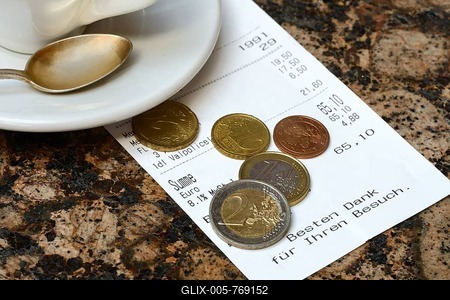Tip, euro coins with receipt-stock-foto