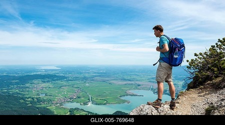 Hiker on trail, looking into distance, Lake Kochel, Herzogstand-Heimgarten ridge walk, Upper Bavaria, Bavaria, Germany-stock-foto