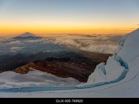 View from the glacier of the Cayambe volcano to its shadow at sunrise, Cayambe, Pichincha province, Ecuador-stock-foto