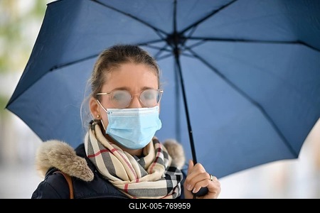 Woman with face mask and umbrella, fogged glasses, portrait, corona crisis, Stuttgart, Baden-Württemberg, Germany-stock-foto