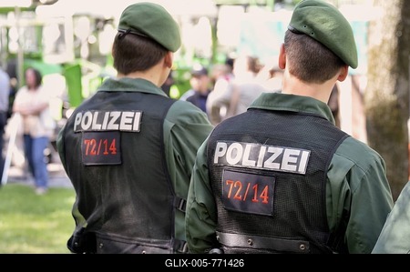 Two police officers watching a demonstration, back view, lettering Polizei or police, Munich, Bavaria, Germany, Europe-stock-foto