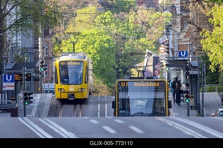 Bus and light rail over hill and dale. Public transport in Stuttgart at Eugensplatz. Stuttgart, Baden-Württemberg, Germany-stock-foto