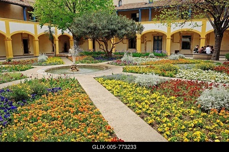 Garden with a fountain, Espace Van Gogh cultural centre, a former hospital in Arles, Bouches-du-Rhone department, Provence-Alpes-Cote d'Azur, Southern France, France, Europe-stock-foto