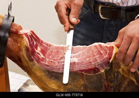 Butcher slicing ham-stock-foto