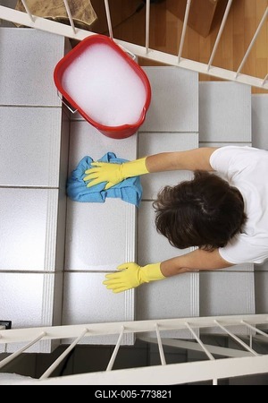 House work, woman cleaning, wiping stairs in a flat-stock-foto