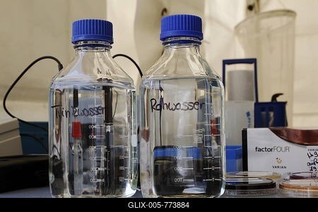 Plastic bottles with untreated water and drinking water on a laboratory table at the Stadtwerke Trier public utilities water purification plant, Rhineland-Palatinate, Germany, Europe-stock-foto