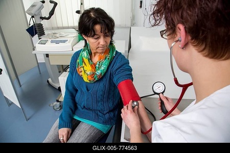 Doctor's office, patient gets her blood pressure taken by a  doctor's assistant, Germany-stock-foto