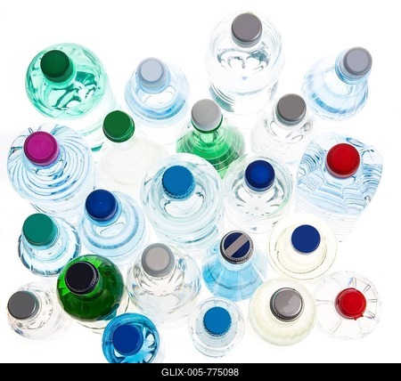 Different varieties of mineral water in bottles made of glass and plastic or PET-stock-foto