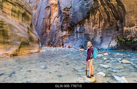Hiker standing in river, Zion Narrows, narrow of the Virgin River, steep faces of Zion Canyon, Zion National Park, Utah, USA-stock-foto