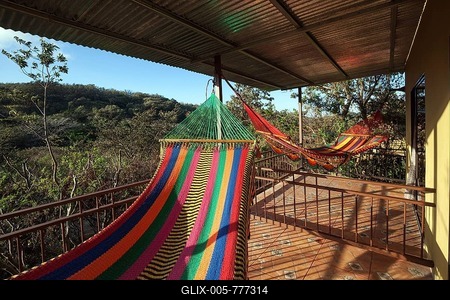 Colourful hammocks on the terrace, Rinconcito Lodge at Rincon de la Vieja National Park, near Liberia, Guanacaste Province, Costa Rica-stock-foto