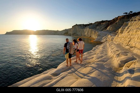 Tourists during sunset, rocky coast of Scala dei Turchi, limestone rocks, Realmonte, Province of Agrigento, Sicily, Italy-stock-foto