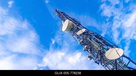 Communication tower with antennas prepared for mobile phones and internet with a blue sky in the background-stock-foto